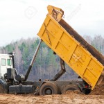 Tipper Truck - 12075902-dump-truck-unloading-a-mountain-of-soil-from-the-body